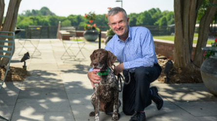 Dr. Lascelles posing with dog
